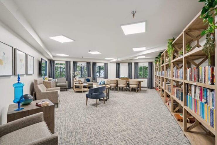 Cozy common area with bookshelves and seating.