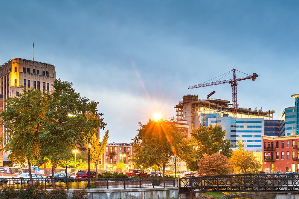 Cityscape with construction and greenery