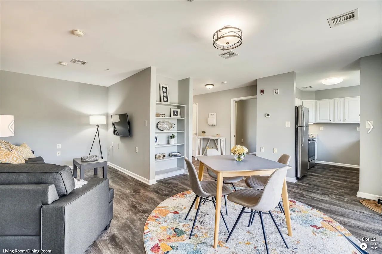 Modern living and dining room with a table and chairs