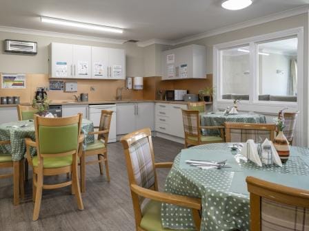 Bright dining area with tables set for meals