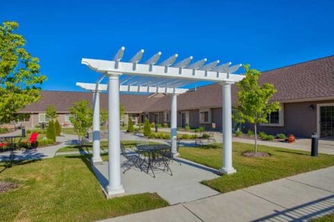 Outdoor courtyard with pergola and seating