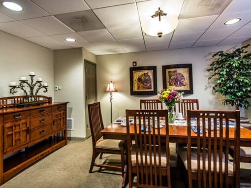 Dining area with a large wooden table and chairs