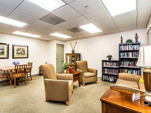 Bright common area with seating and bookshelves