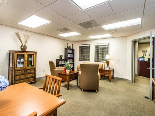 Comfortable common area with seating and bookshelves