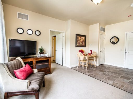 Cozy resident room with seating and dining area