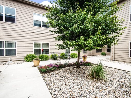 Outdoor courtyard with seating and landscaping