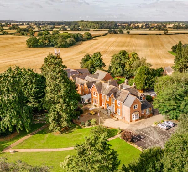 Aerial view of Hadleigh Care Home surrounded by green fields