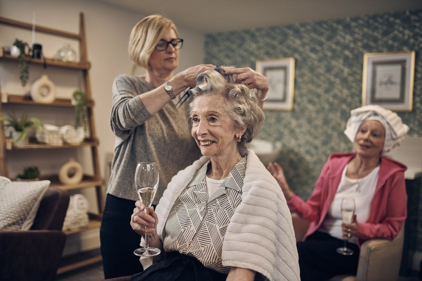 Residents enjoying a beauty treatment in a cozy common area