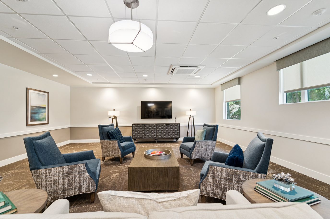 Bright common area with seating and television
