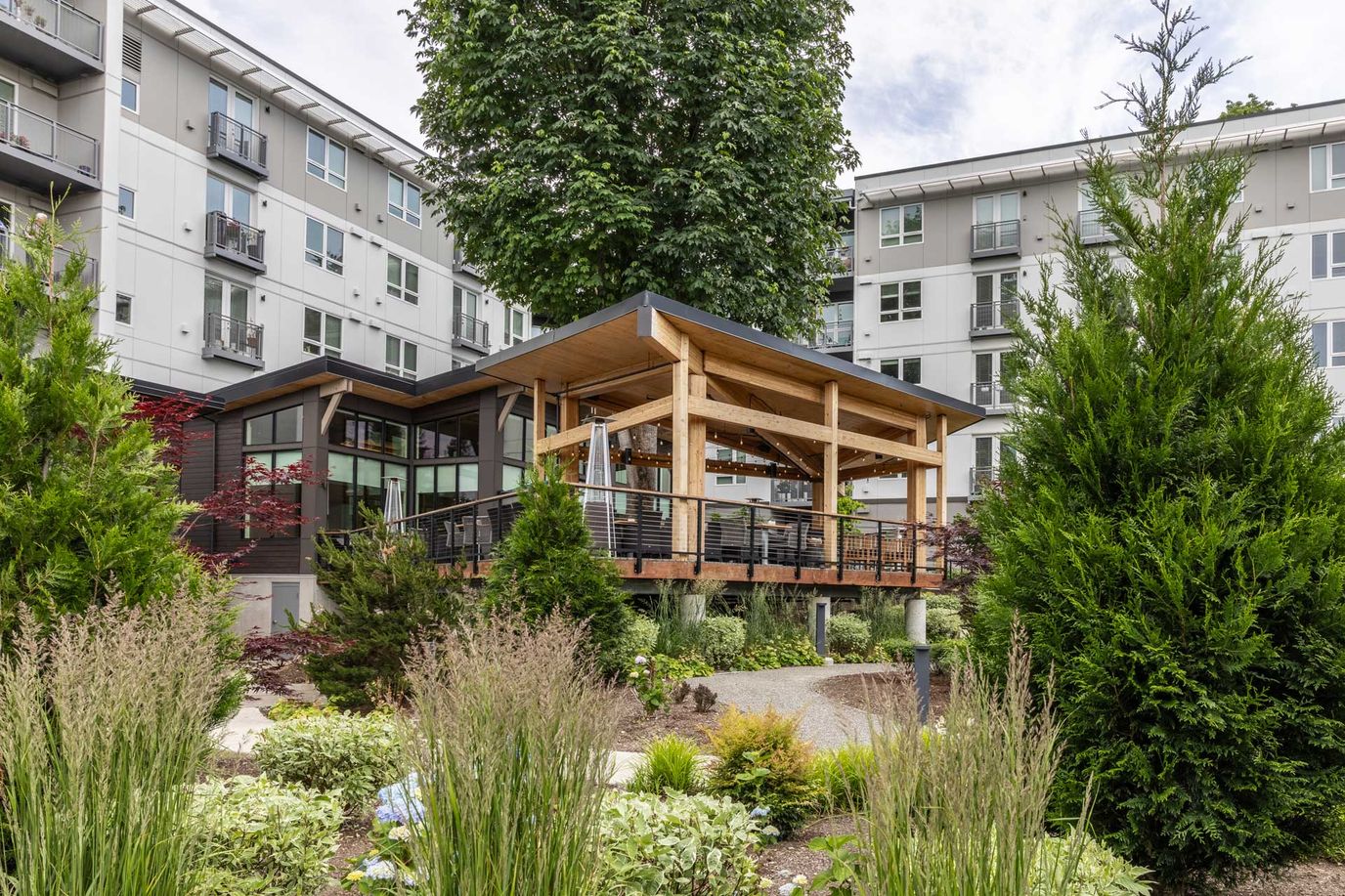 Outdoor patio area surrounded by gardens