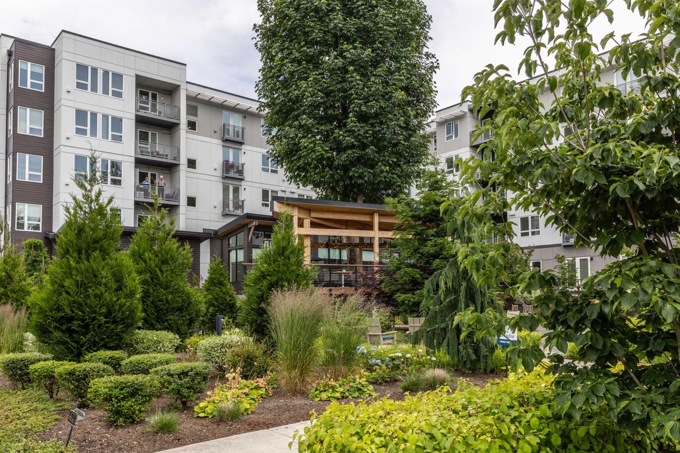 View of the landscaped outdoor area with residential building.
