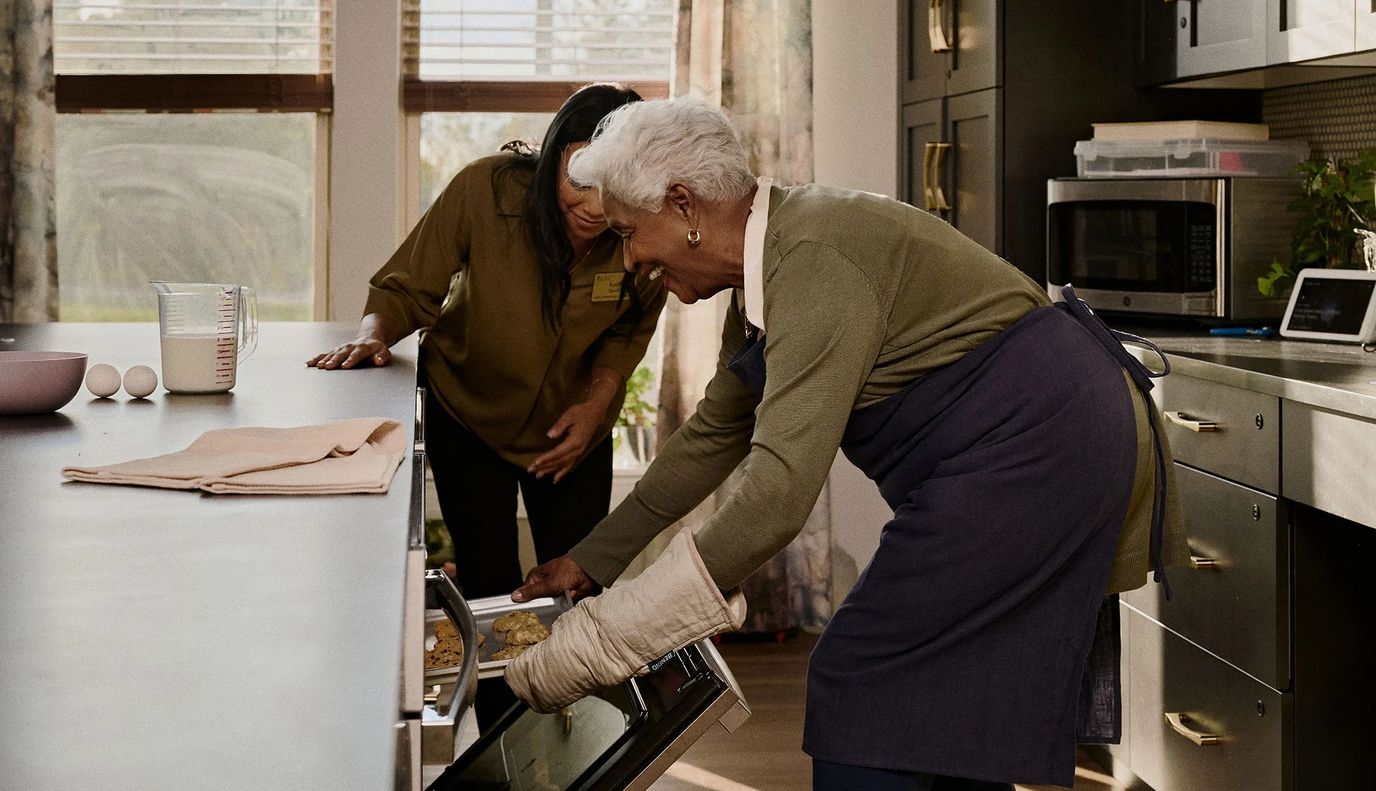 Residents and staff baking cookies together