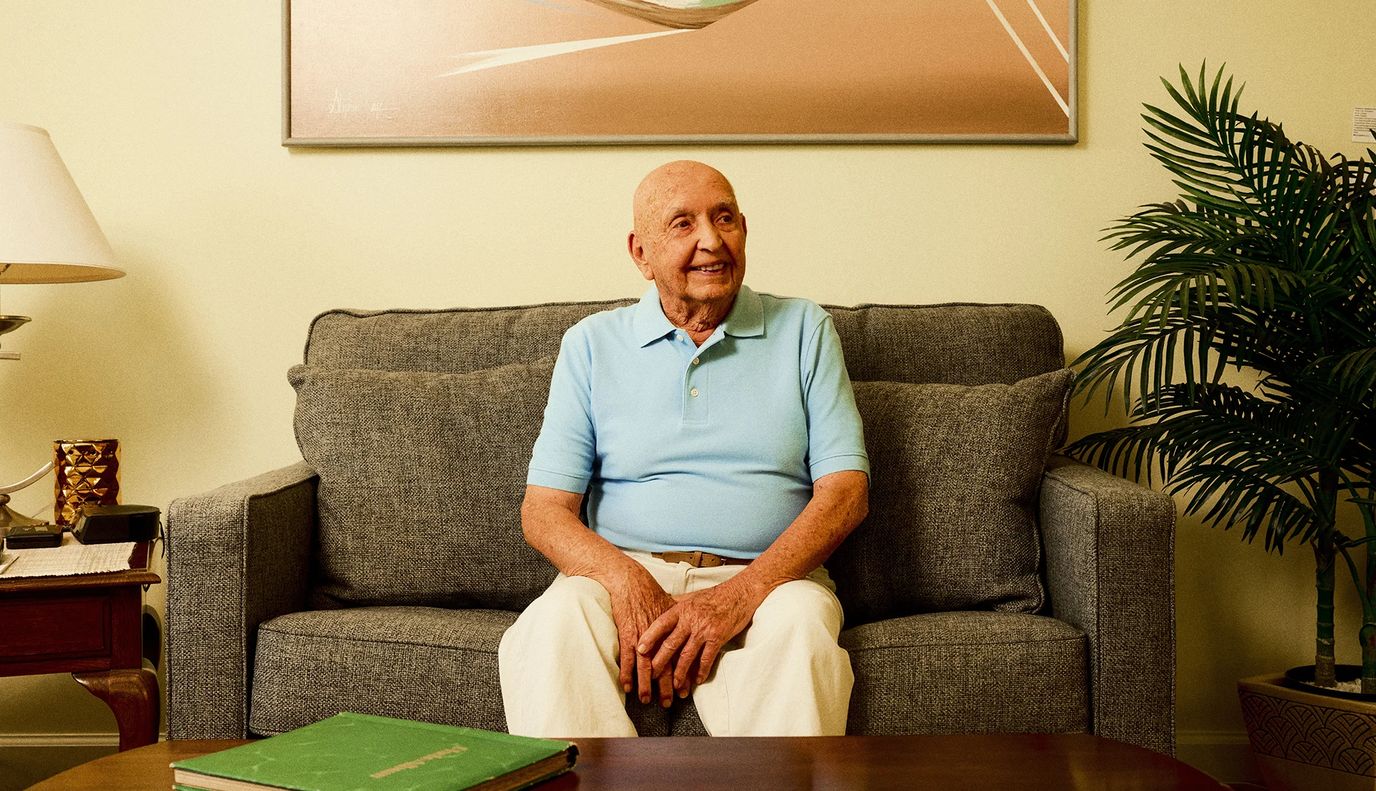 Senior man sitting comfortably on a couch