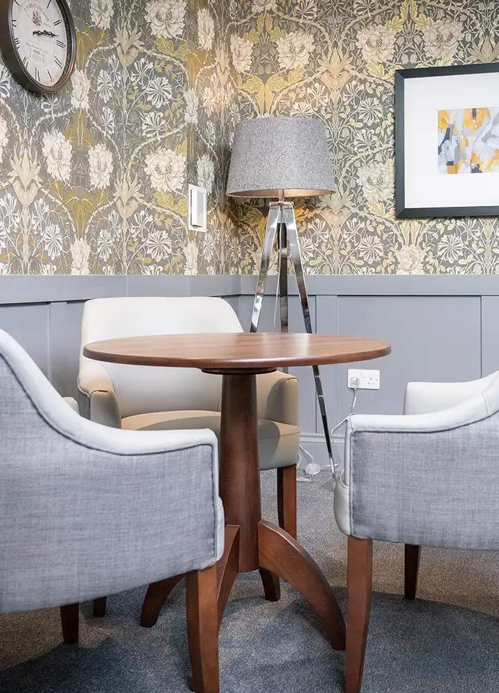 Cozy sitting area with armchairs and a lamp