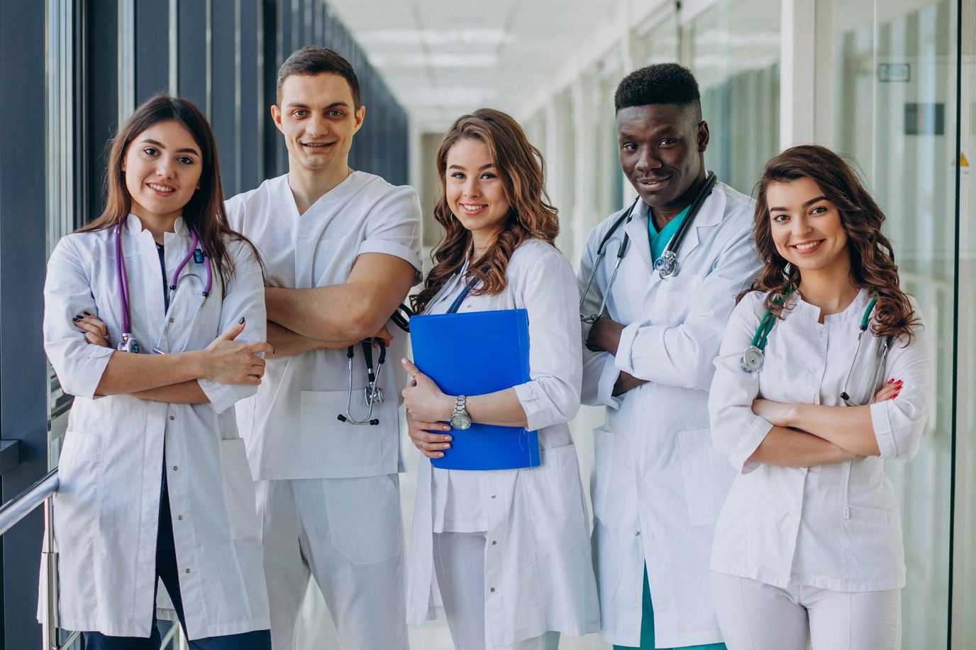 Healthcare staff posing in a corridor