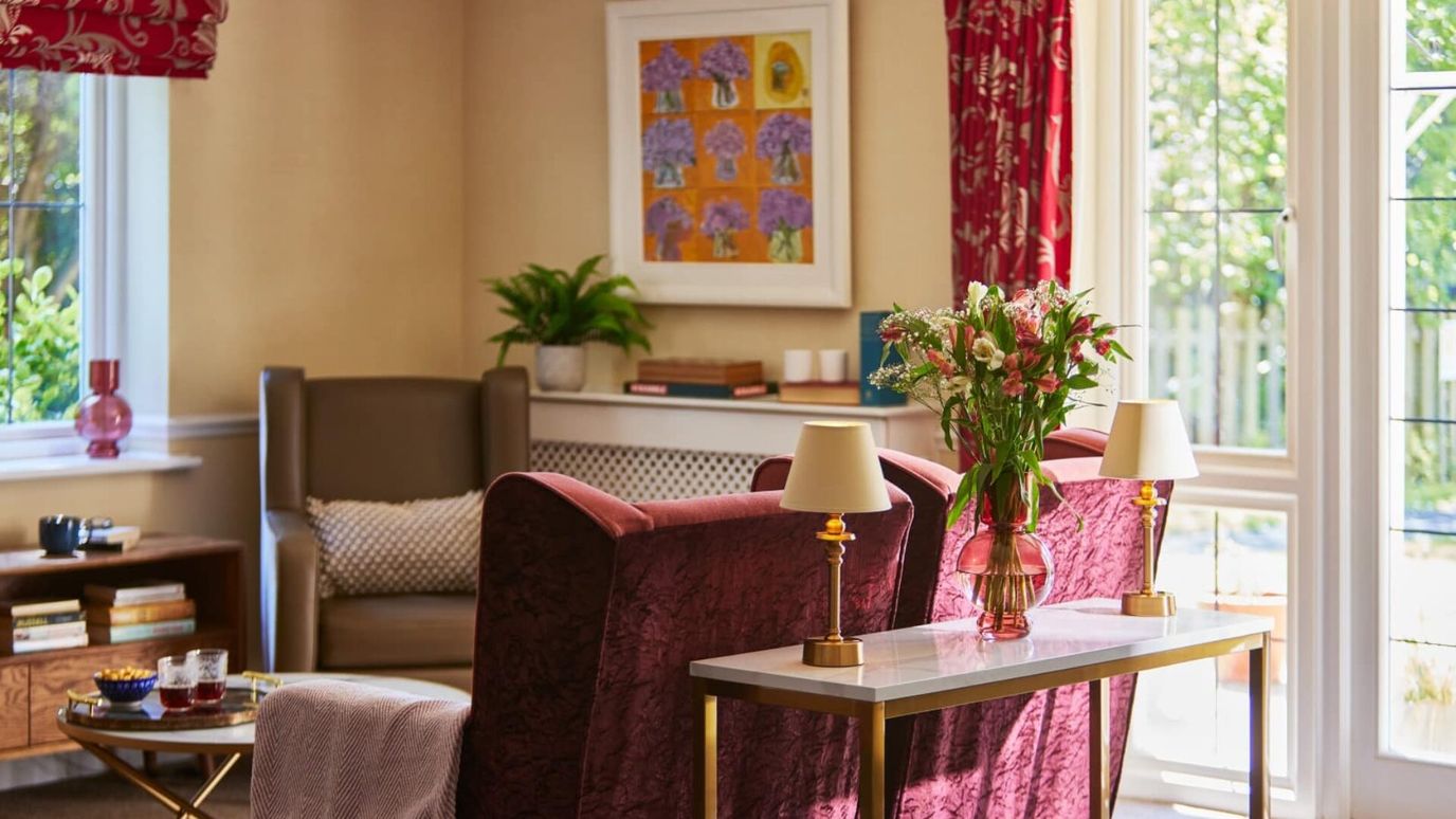 Cozy interior lounge with seating and flowers