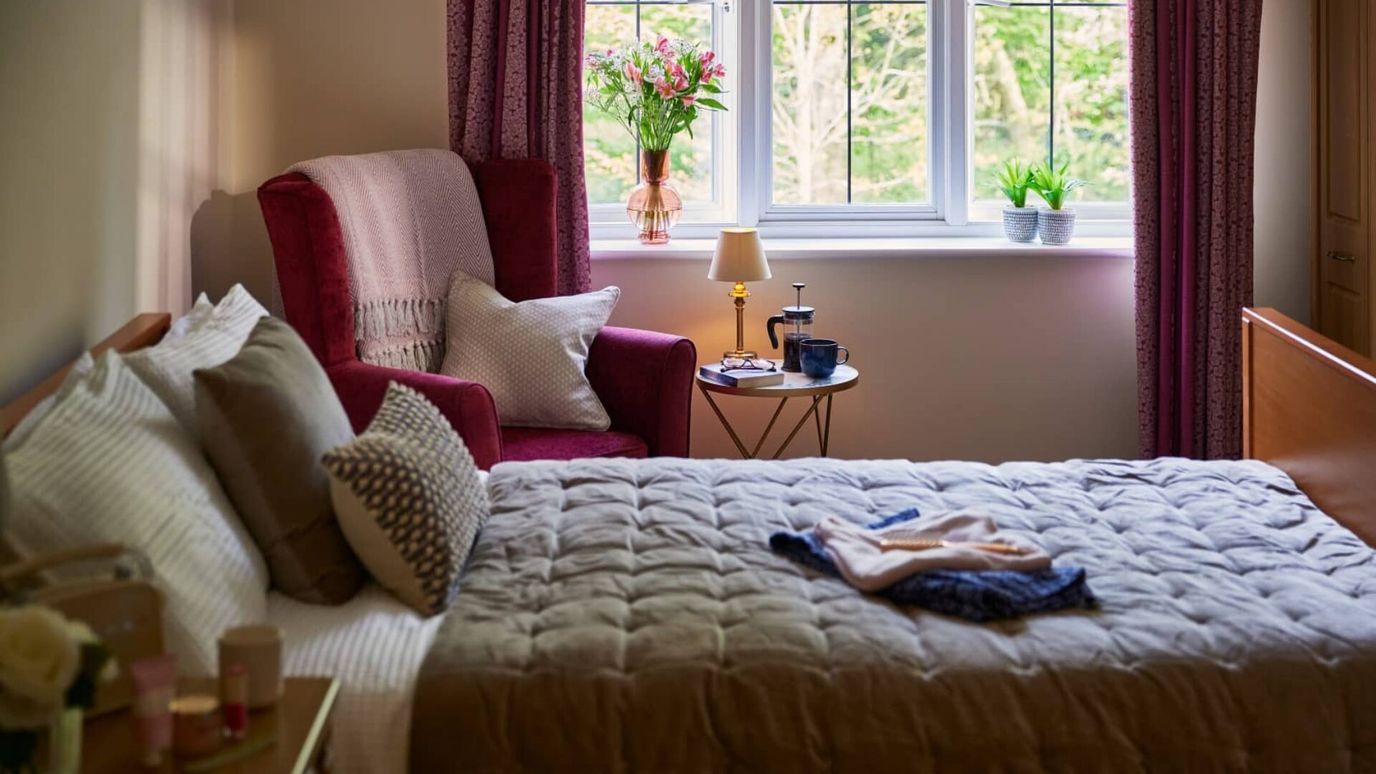 Cozy resident room with homey decor and natural light
