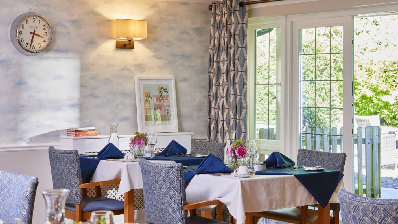 Dining area with tables set for a meal