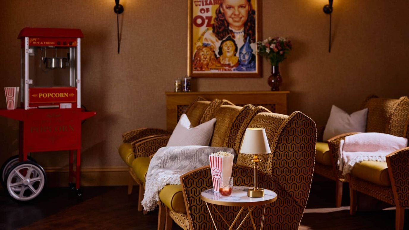 Interior view of a cozy common area with popcorn machine