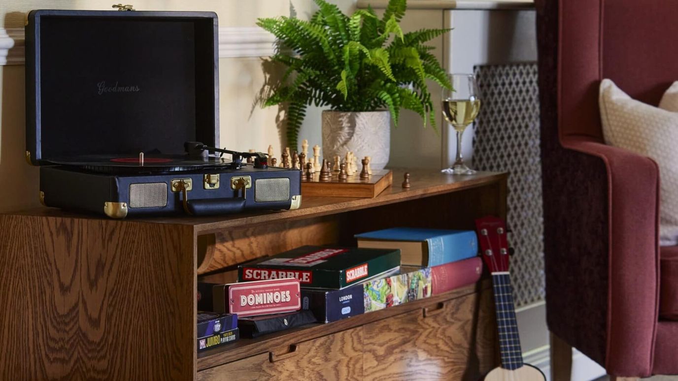 Cozy interior scene with a vintage record player and games