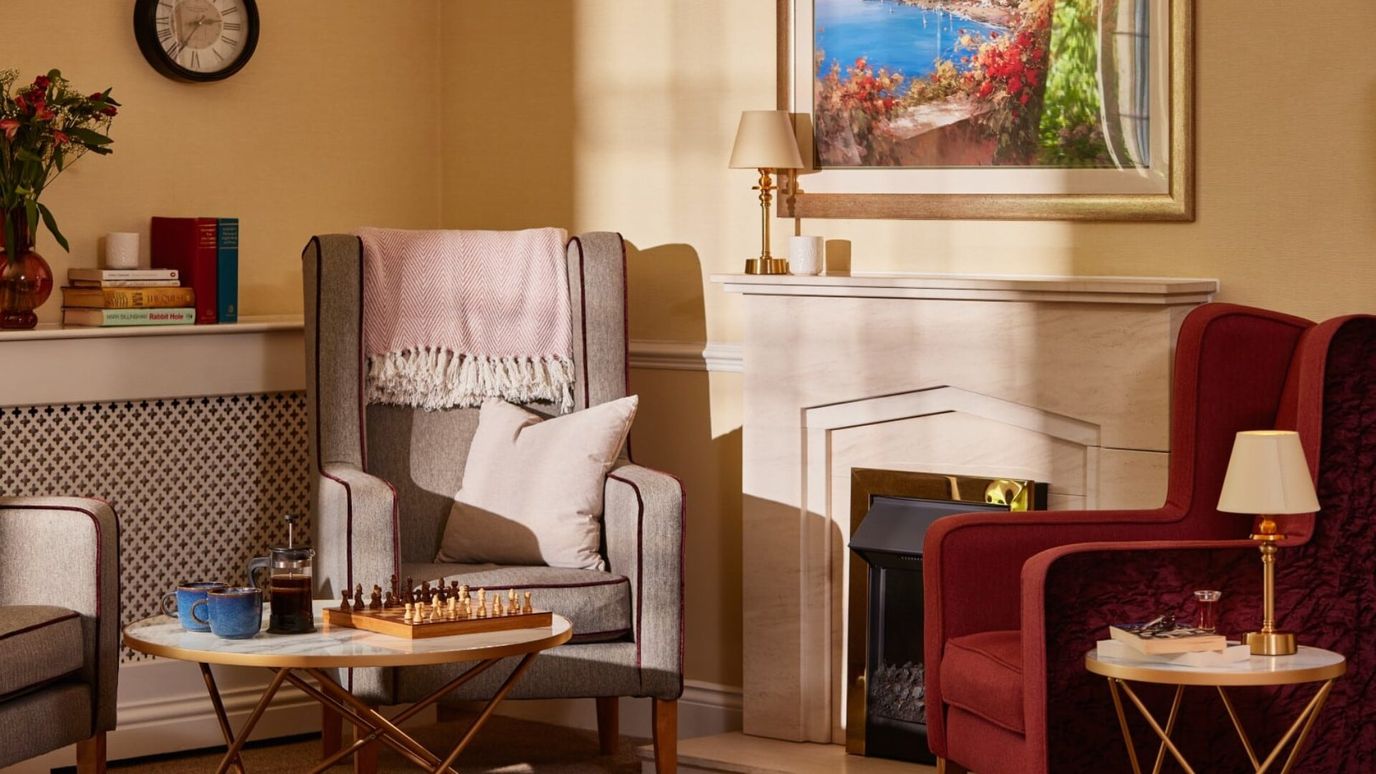 Cozy common area with armchairs and chess set
