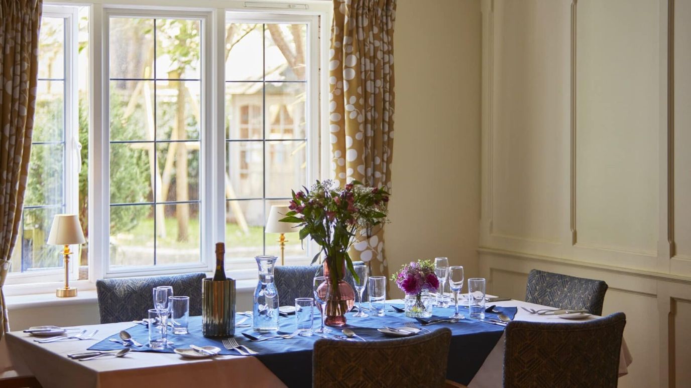 Beautiful dining room setup with flowers and table settings