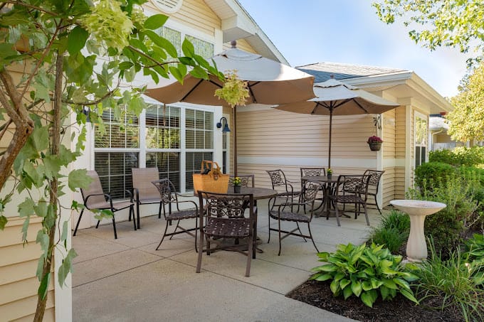 Patio with tables and chairs under umbrellas