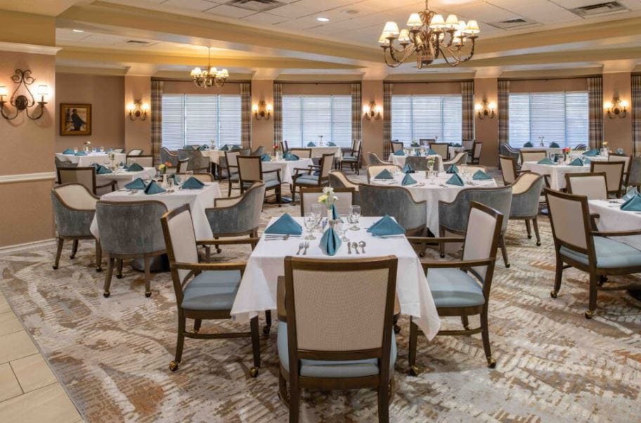 Elegant dining room with tables set for a meal