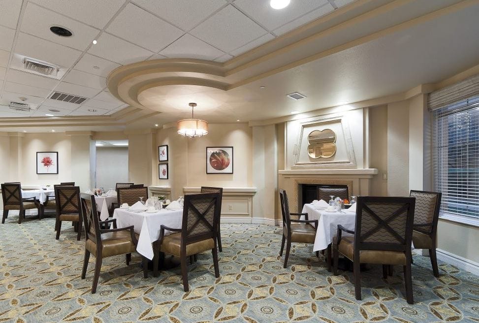 Elegant dining room with tables set for meals