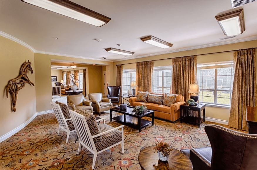 Comfortable living room with seating and natural light.