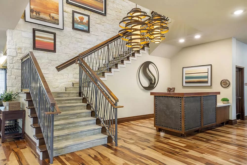Entry lobby with a staircase and reception desk