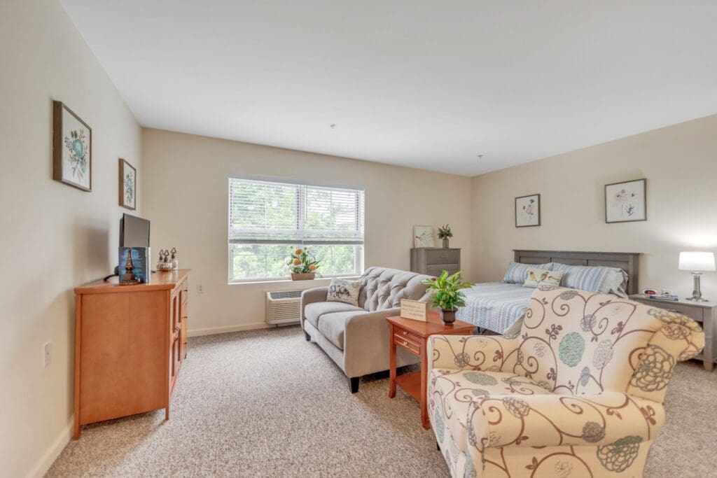 Cozy resident room with a couch and bed