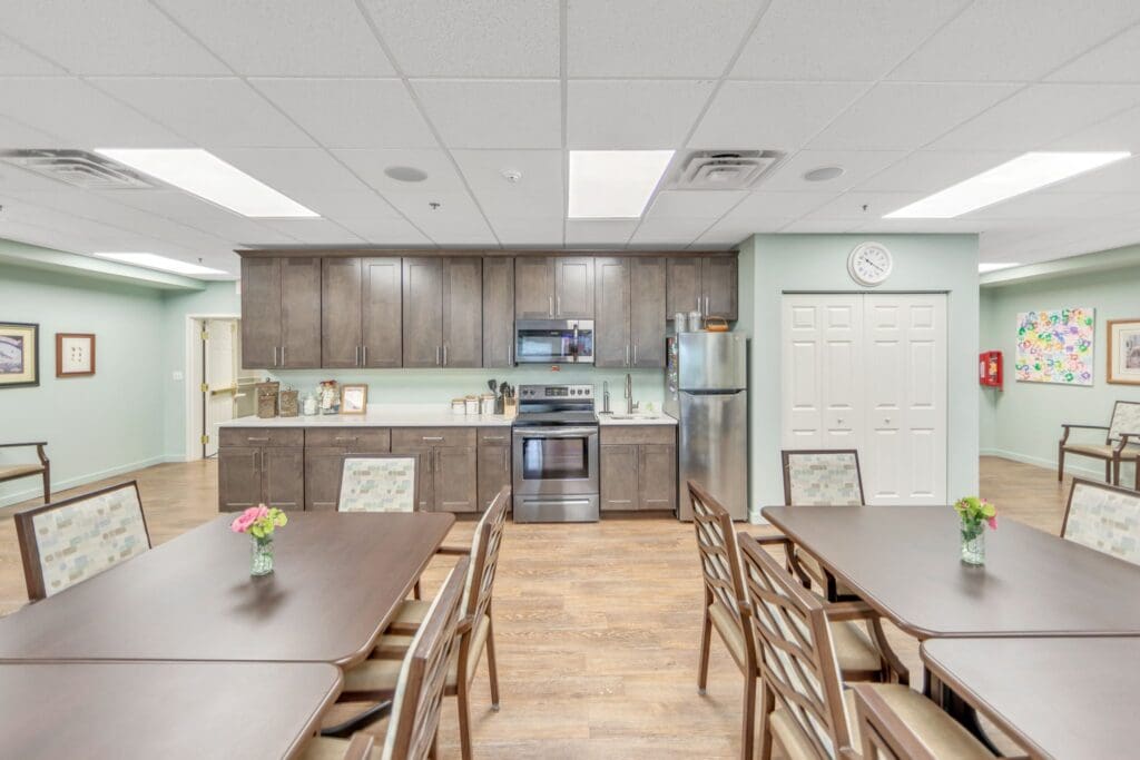 Dining area with tables and kitchen appliances