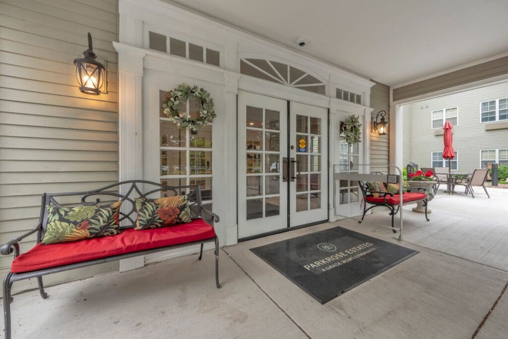 Entrance area of Parkrose Estates with seating and flower decorations