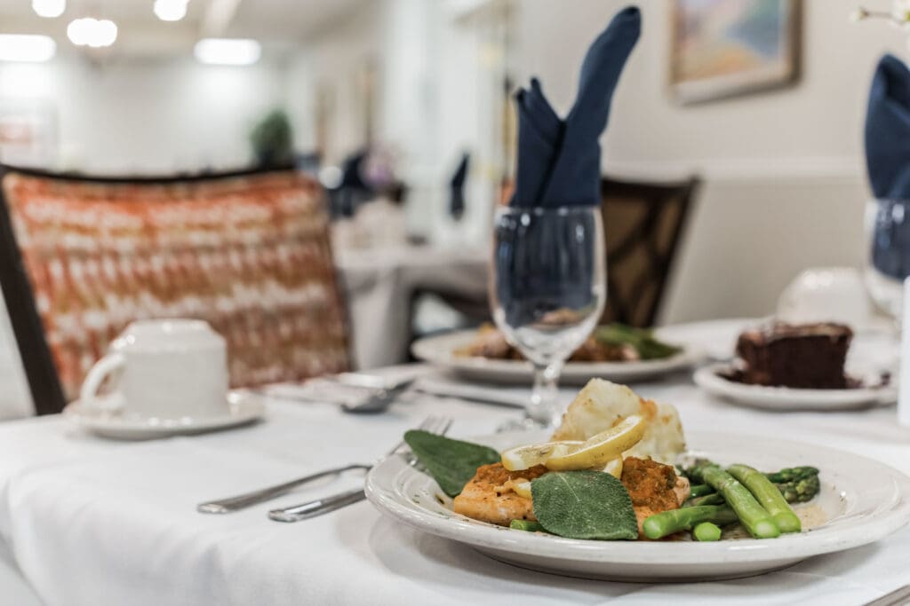 Elegant dining setup with gourmet meal and drinks