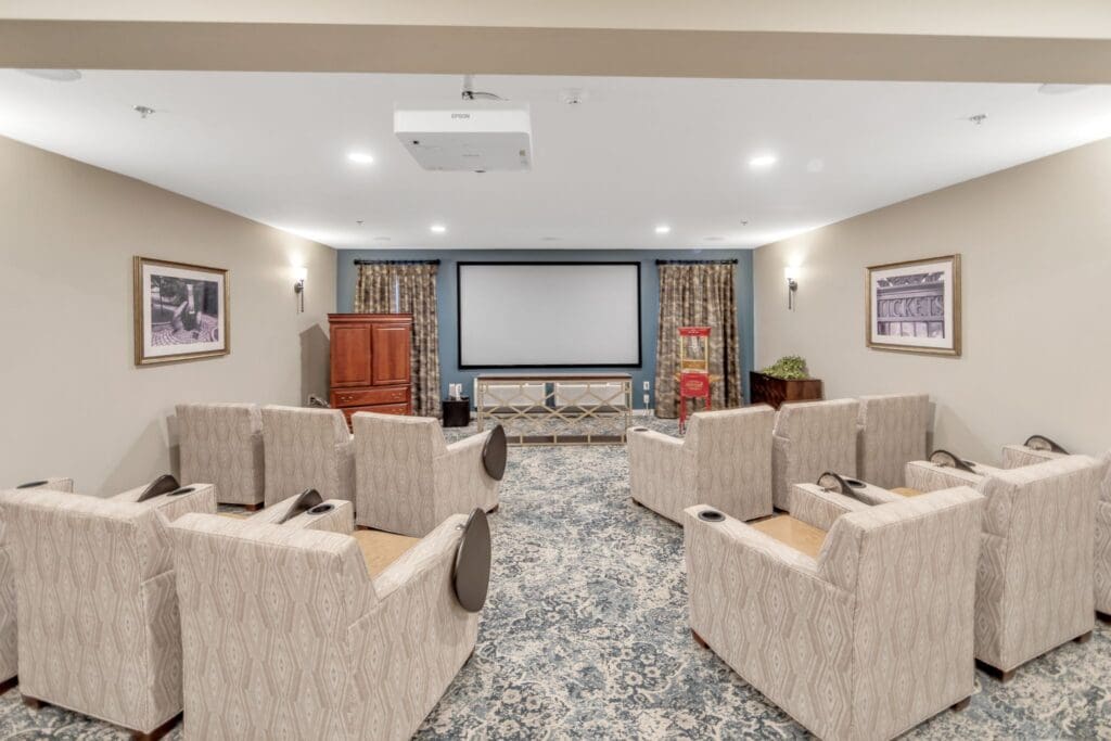 Comfortable common area with seating and a projector
