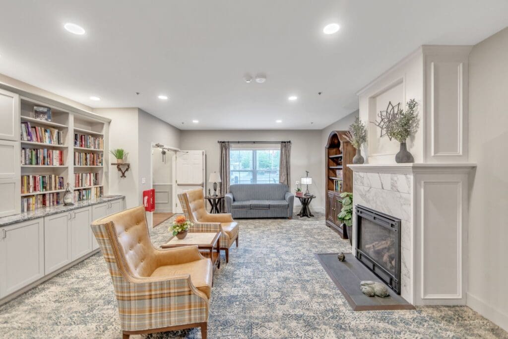 Interior common area with seating and bookshelves