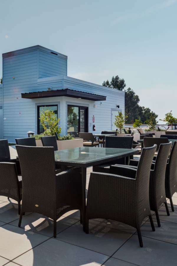 Outdoor seating area with tables and chairs