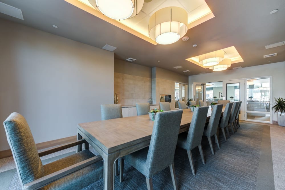 Elegant dining room with a long table and modern lighting