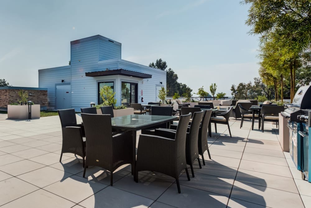 Outdoor seating area with tables and chairs