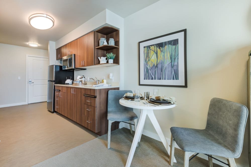 A modern kitchen area in a senior living apartment