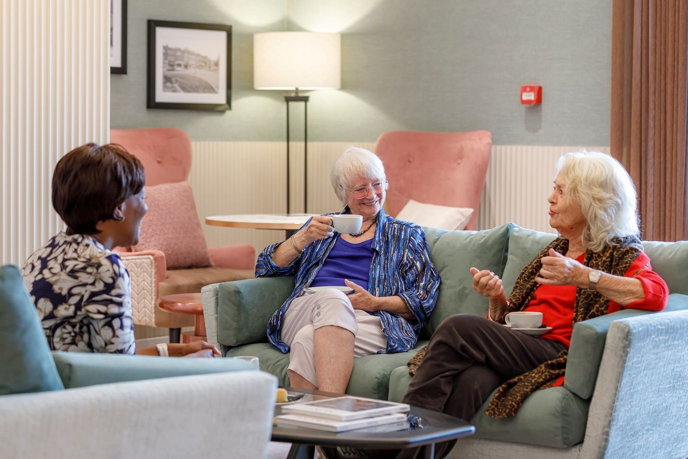 Residents enjoying conversation in a cozy common area