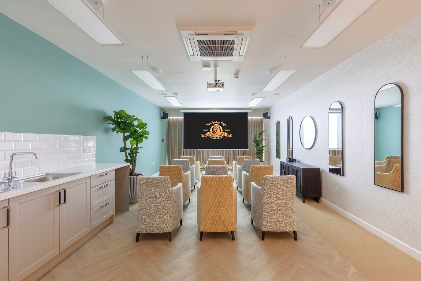 Interior activity room with seating and audiovisual equipment