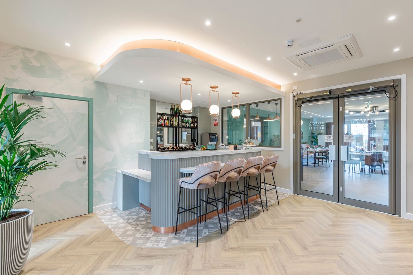 Interior view of a modern communal space with bar seating