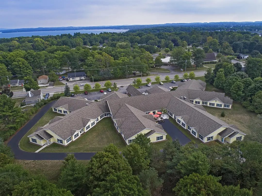 Aerial view of a nursing home facility surrounded by trees