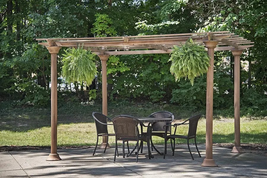 Outdoor seating area with a pergola and plants
