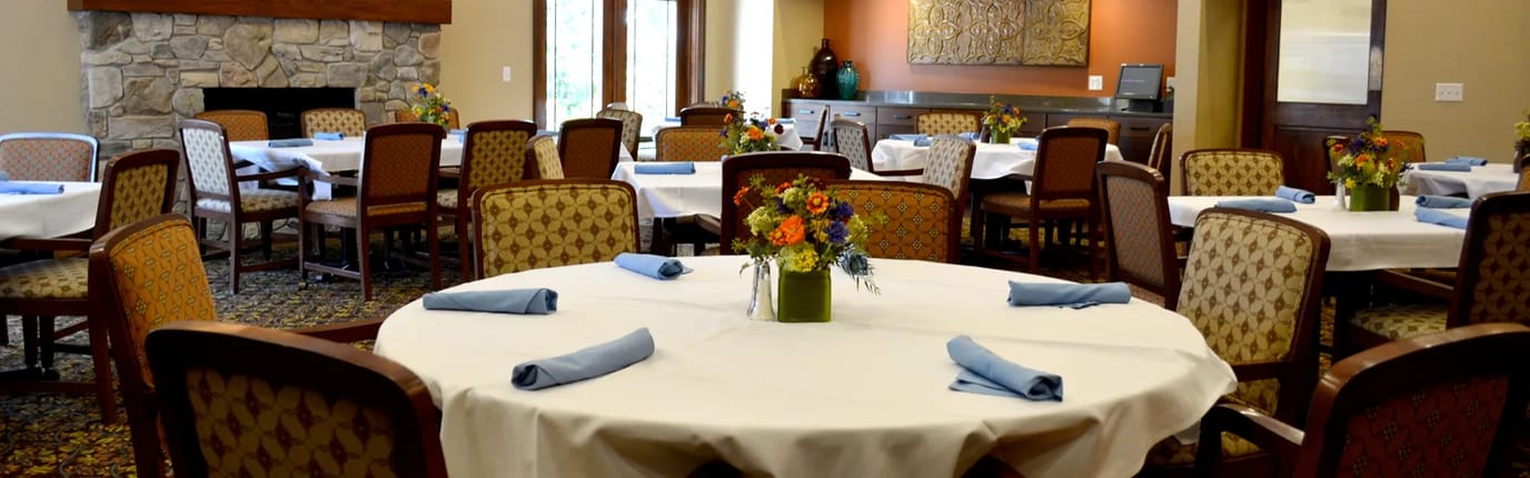 Dining room setup with flowers on tables