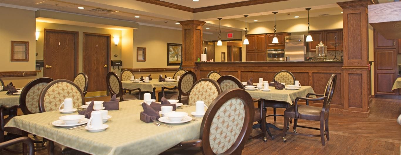Spacious dining room with tables set for meals