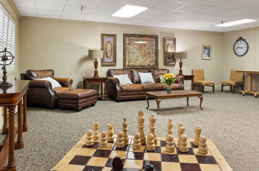 Cozy lounge area featuring a chess set and comfortable seating