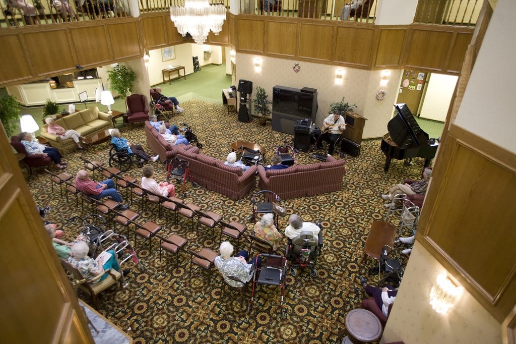 Residents enjoying a live music performance in the common area
